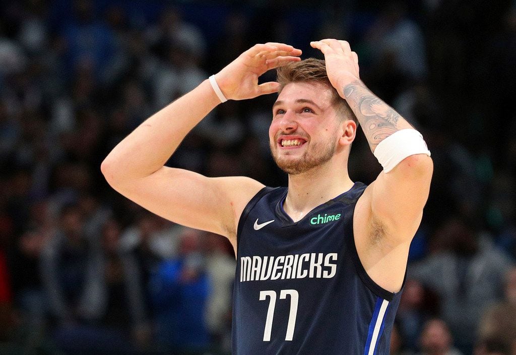 Dallas Mavericks forward Luka Doncic (77) reacts to a missed 3-point attempt by Tim Hardaway...