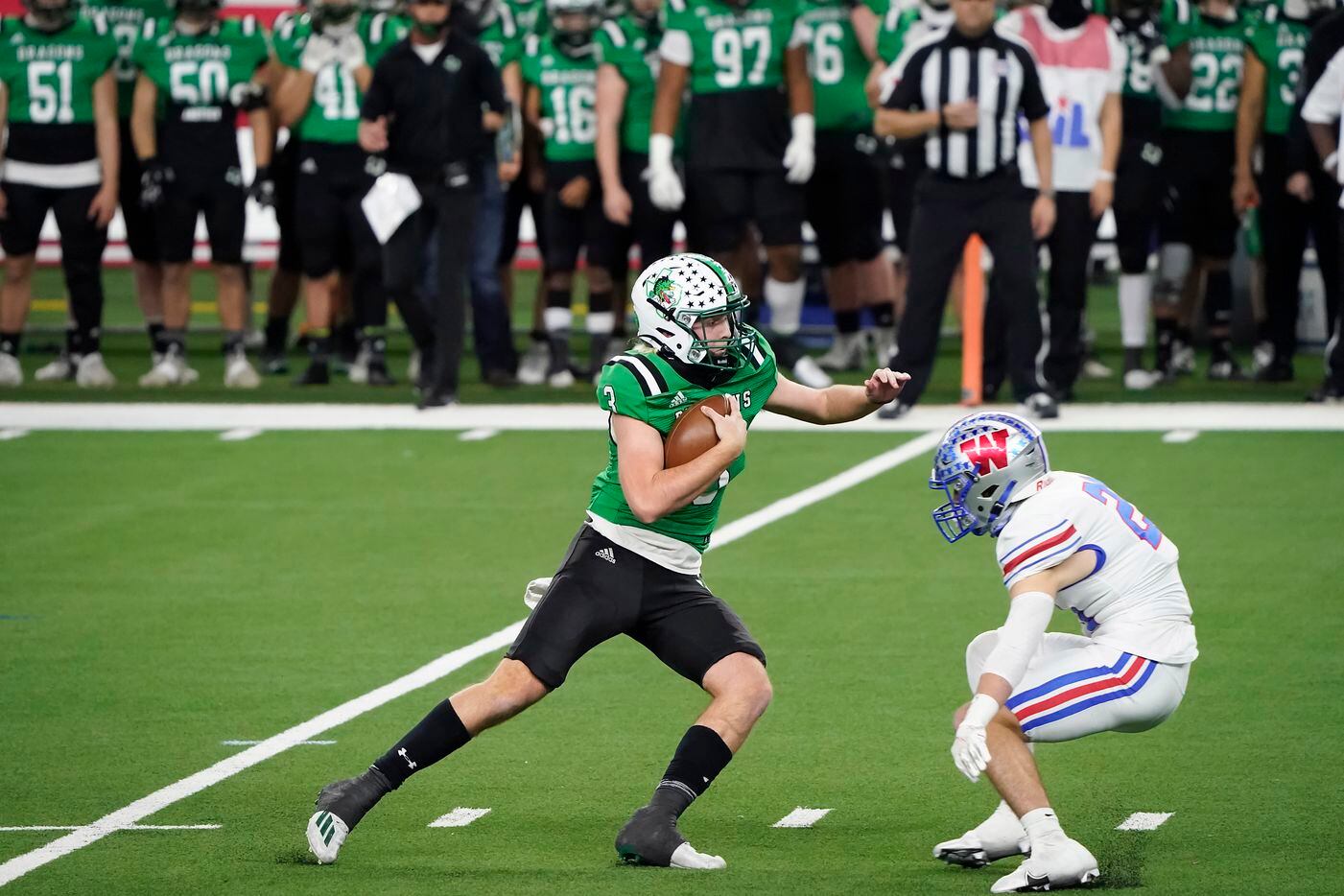 Southlake Carroll quarterback Quinn Ewers (3) tries to get past Austin Westlake defensive back Patrick Churchill (24) during the second quarter of the Class 6A Division I state football championship game at AT&T Stadium on Saturday, Jan. 16, 2021, in Arlington, Texas. (Smiley N. Pool/The Dallas Morning News)
