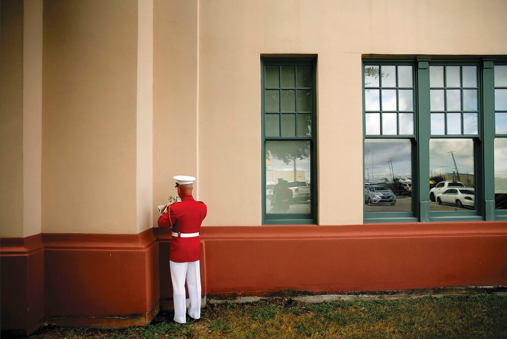 Master Sgt. Michael Fulwood uses a corner of the Women's Museum to warm up on his two-valve soprano bugle before the U.S. Marine Drum and Bugle Corps performance at the State Fair of Texas.
