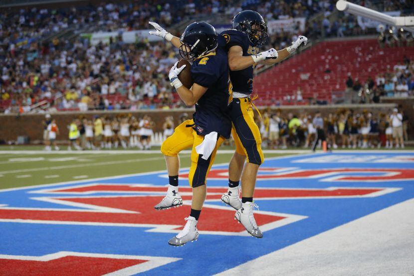 Campbell Brooks (2) and Andrew Frost (3) celebrate Brooks' touchdown during their...