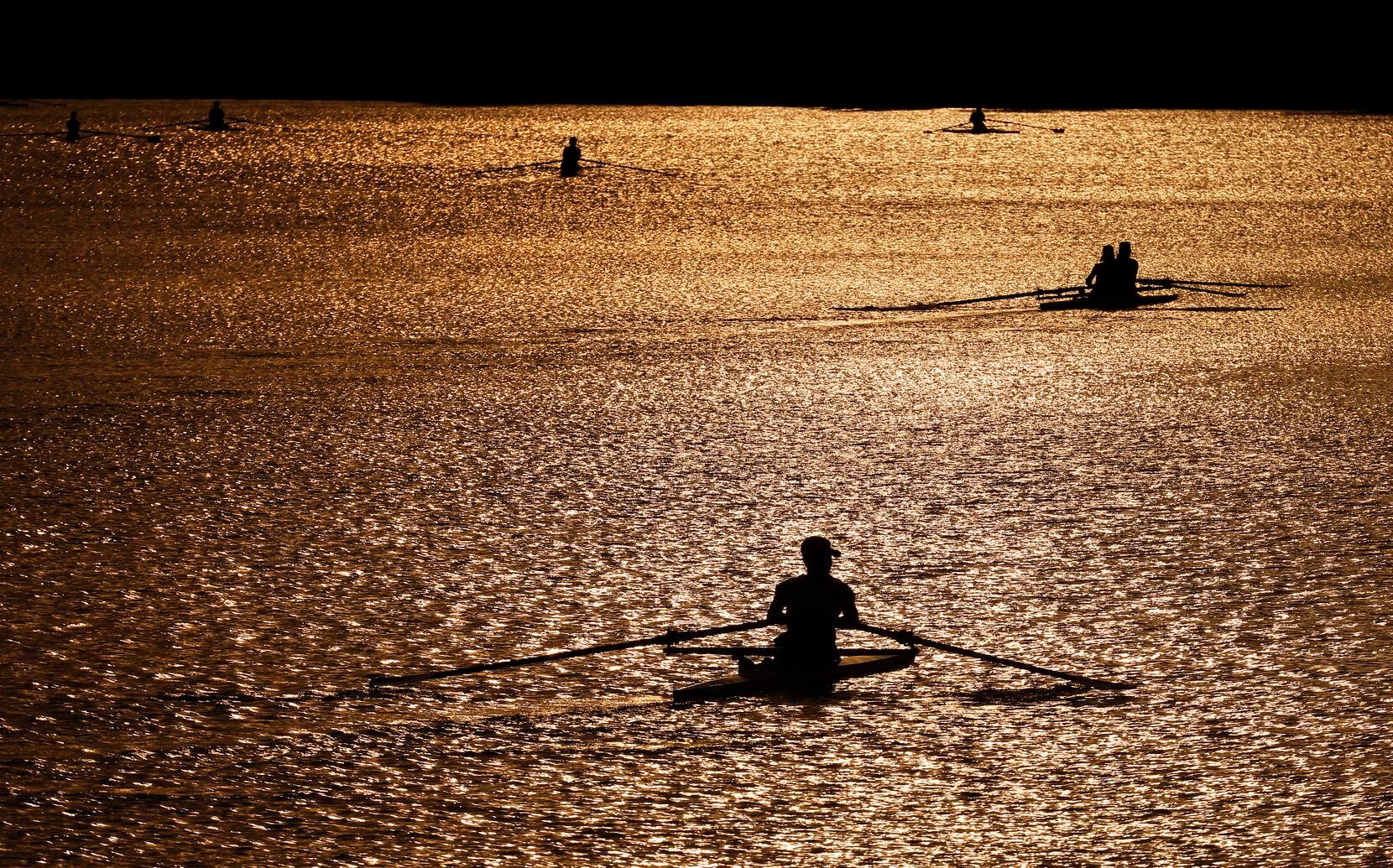 Members of the Dallas Rowing Club and its Juniors program glided across the water during a...