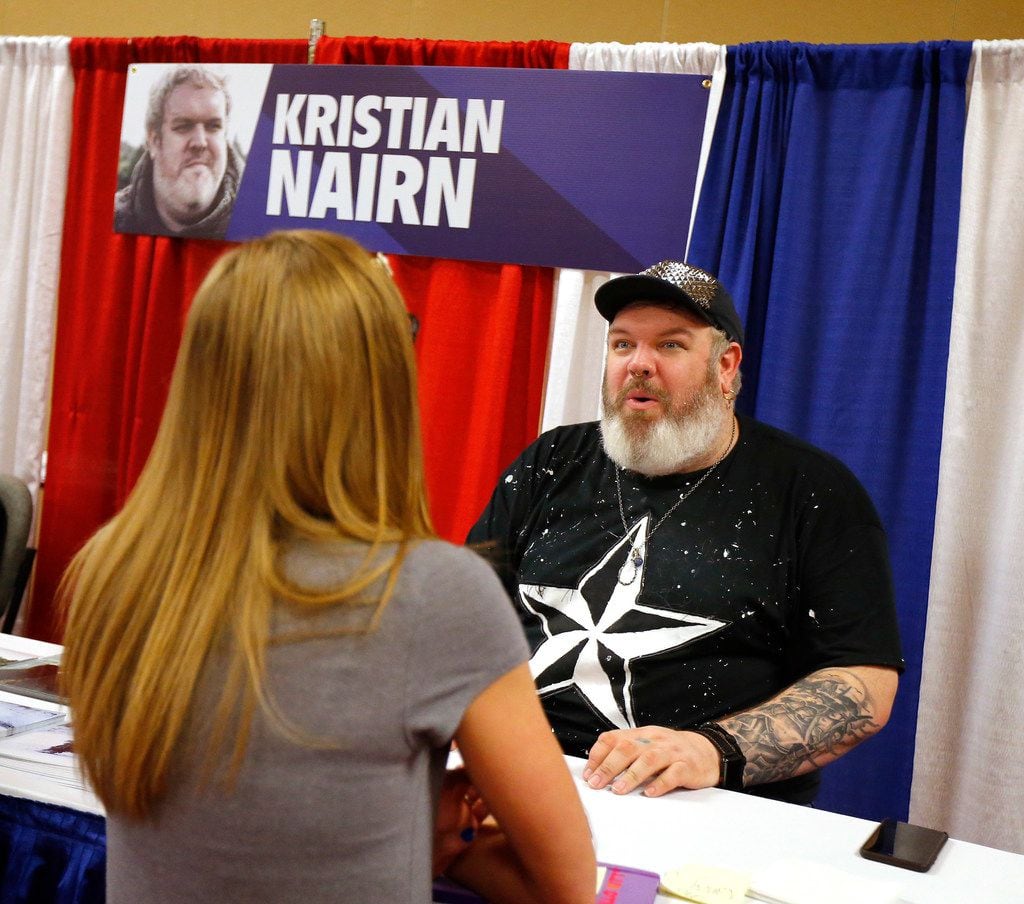 Kristian Nairn, who plays Hodor in Game of Thrones, visits with a fan during Dallas Fan Days...