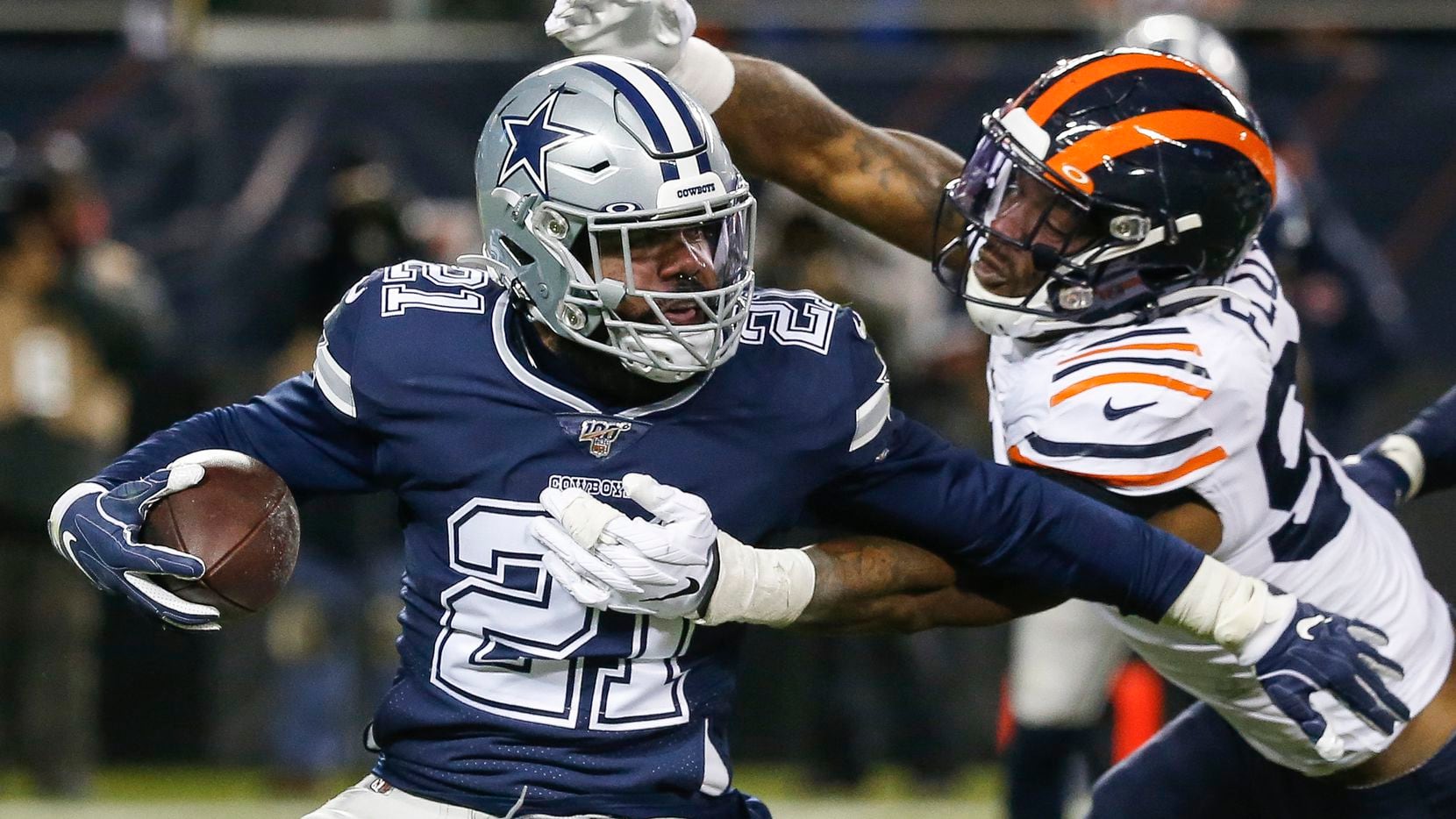 Chicago Bears outside linebacker Leonard Floyd (94) works to bring down Dallas Cowboys running back Ezekiel Elliott (21) during the second half a NFL matchup between the Dallas Cowboys and the Chicago Bears on Thursday, Dec. 5, 2019, at Soldier Field in Chicago.