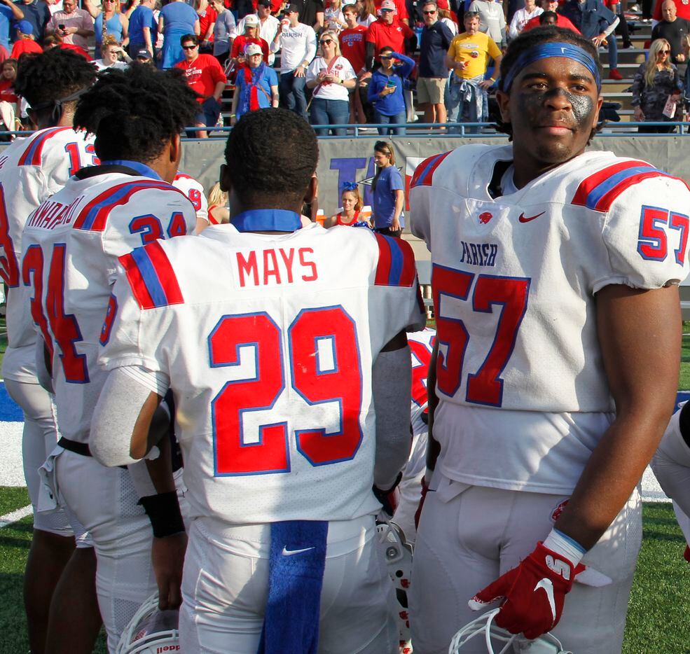 Parish Episcopal defensive lineman Ian Ussery (57), right, soaks in the moment with teammates as they await their medals following the team's 56-17 victory over Midland Christian to capture the state title. The two teams played their TAPPS Division 1 state championship football game at Waco ISD Stadium in Waco on December 4, 2021. (Steve Hamm/ Special Contributor)
