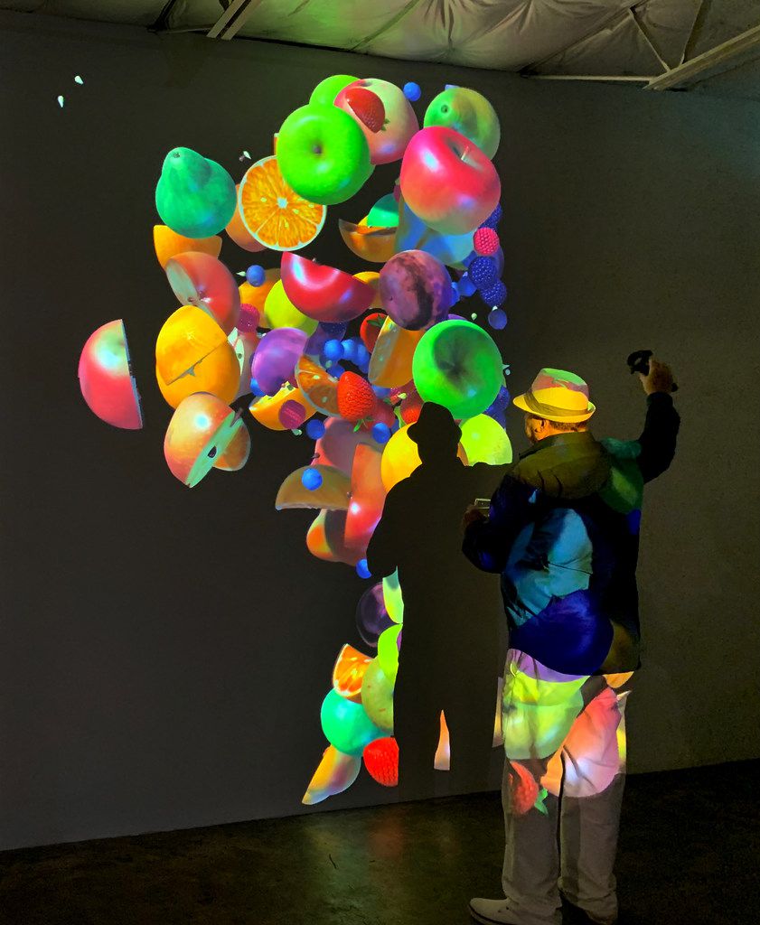 An opening night guest interacts with Womb, 2019, a virtual reality animation with sound, at...