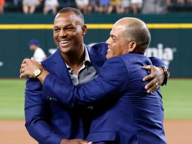 Former Texas Rangers third baseman Adrian Beltre (left) is congratulated by former Rangers...