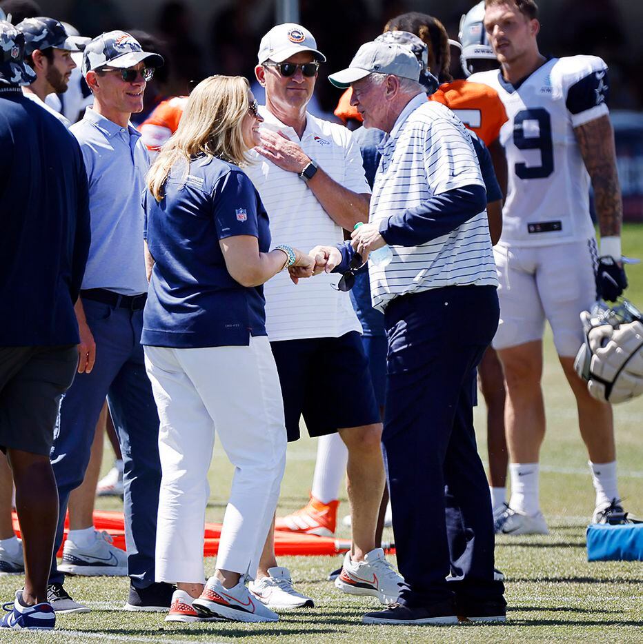 Dallas Cowboys owner Jerry Jones (right) fist bumps new Denver Broncos owners Carrie Penner...