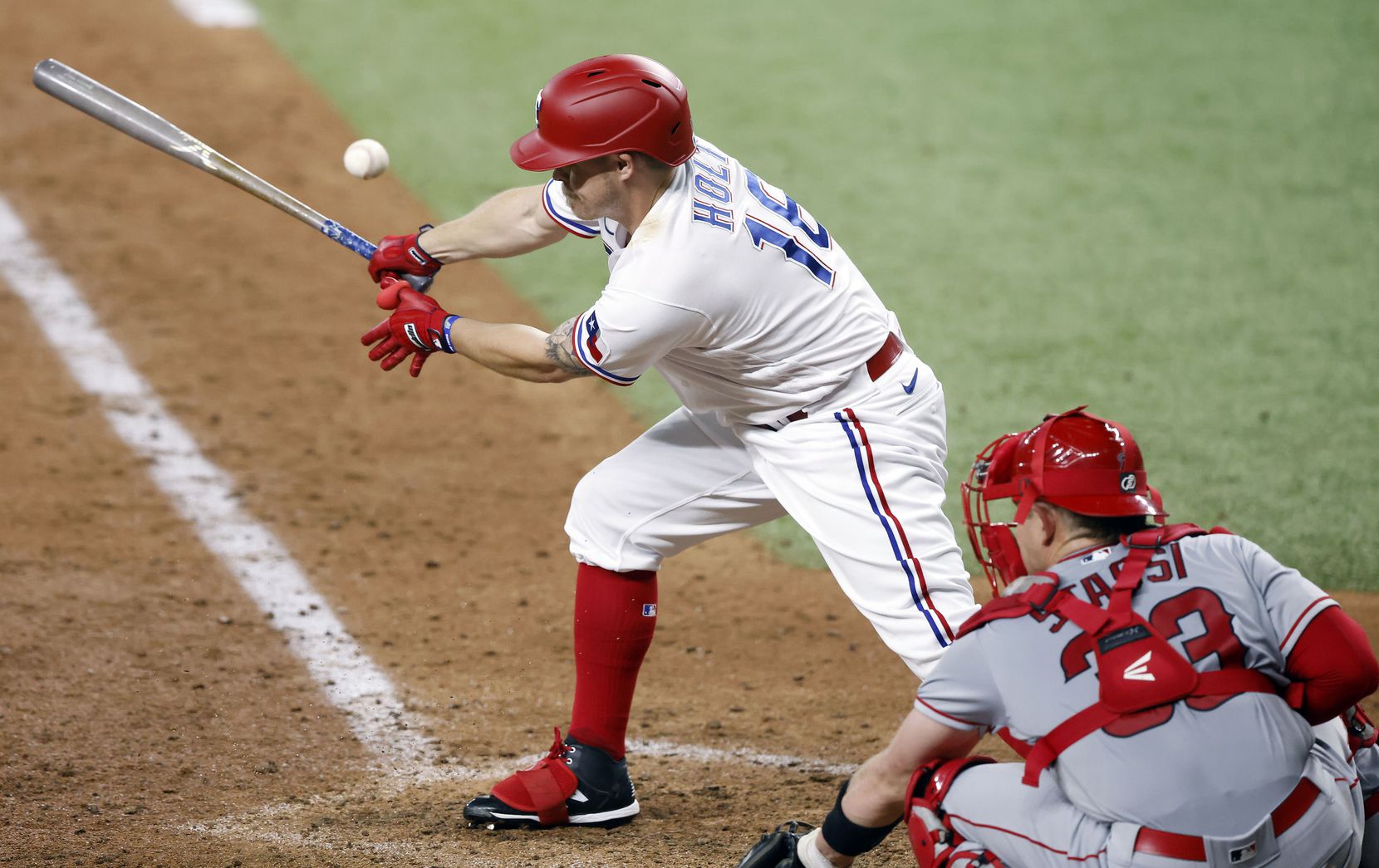 Texas Rangers batter Brock Holt (16) fouls off a pitch from Los Angeles Angels relief pitcher Tony Watson during the seventh inning at Globe Life Field in Arlington, Texas, Wednesday, April  28, 2021. (Tom Fox/The Dallas Morning News)