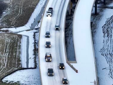 An icy mix covers Highway 114 on Monday, Jan. 30, 2023, in Roanoke.  Dallas and other parts...