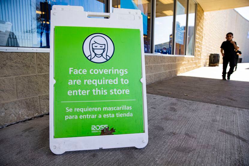 A face covering required sign at the Ross in City Place in Dallas on Tuesday, March 2, 2021....