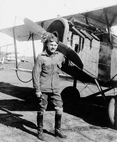 Lt. William T. Campbell stands by his special Curtiss biplane, having broken the world...