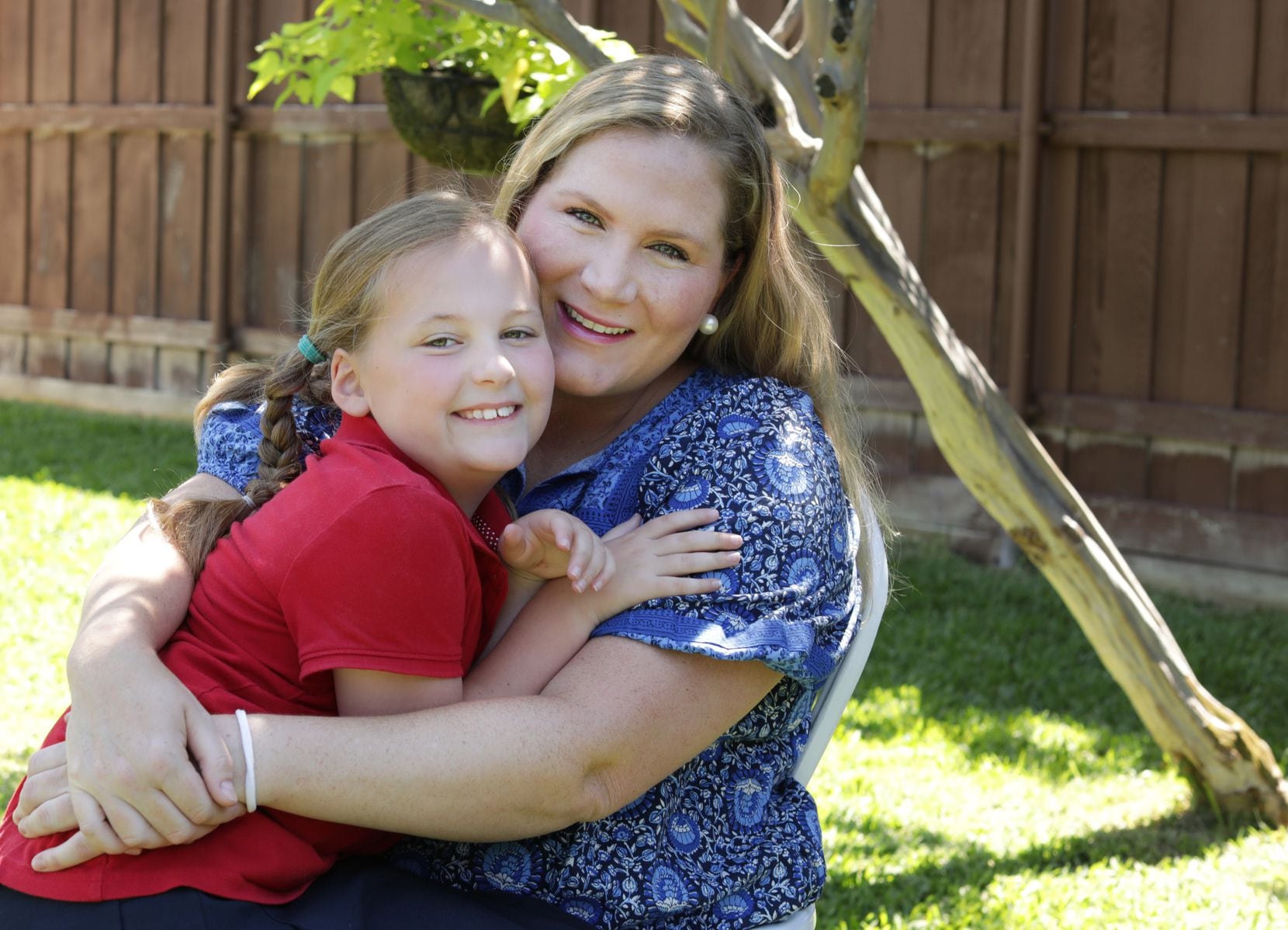 7-year-old Hattie Decker, left, and her mother Cassie Evans at their home in Dallas on May...
