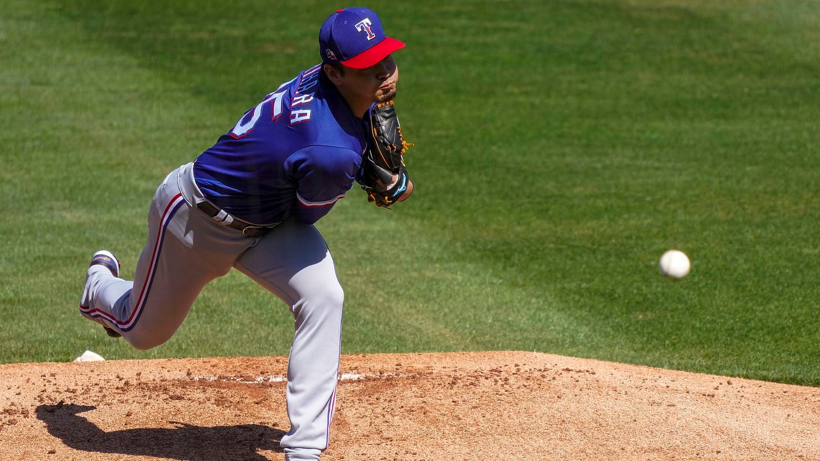 Texas Rangers pitcher Kohei Arihara delivers during the first inning of a spring training...