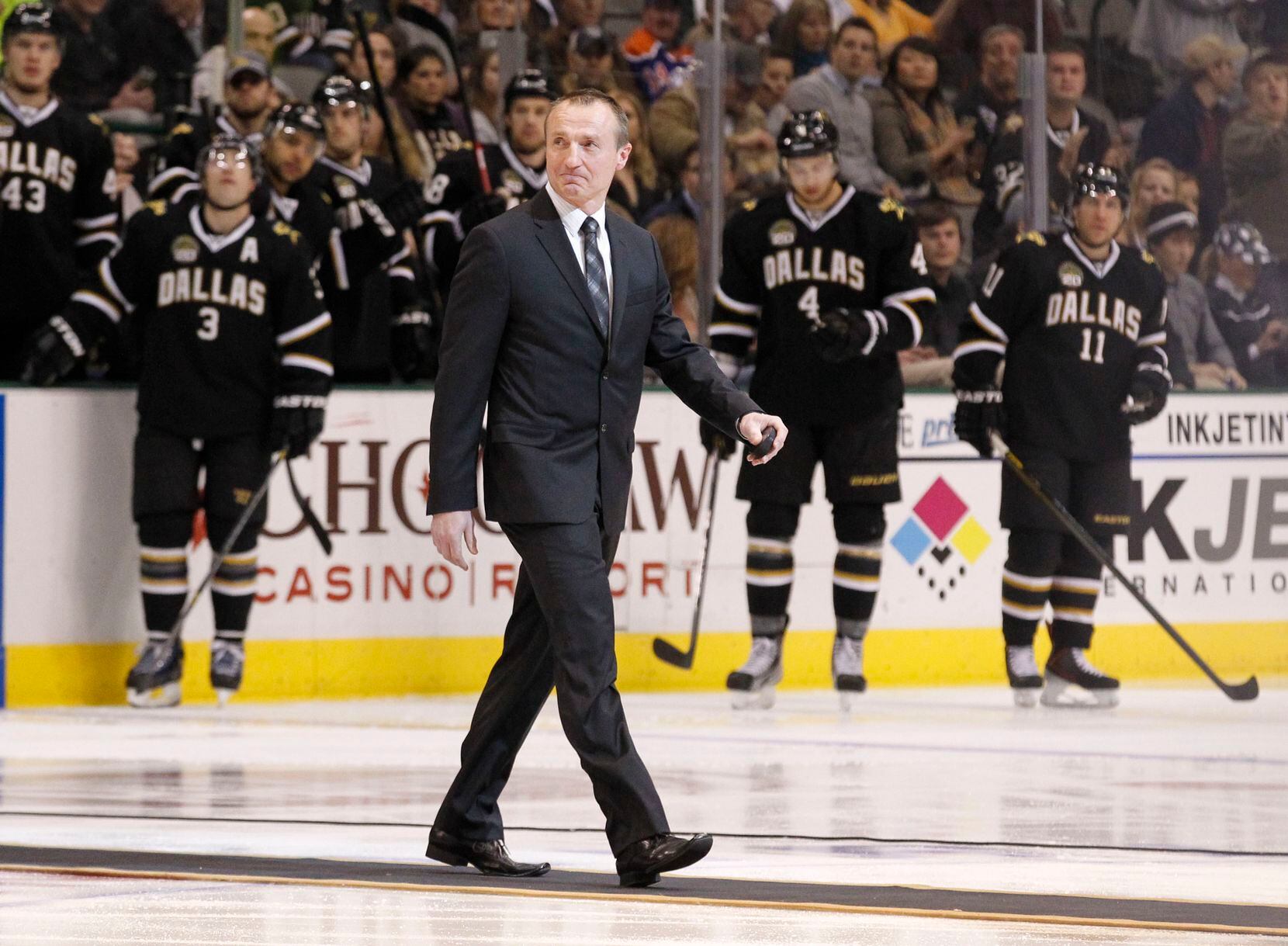 Former Dallas Stars player Jere Lehtinen, prepares for the ceremonial puck drop prior to the...