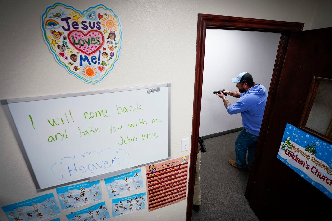 Tyler Brooks practices searching a hallway of Sunday school classrooms during a Sheepdog...