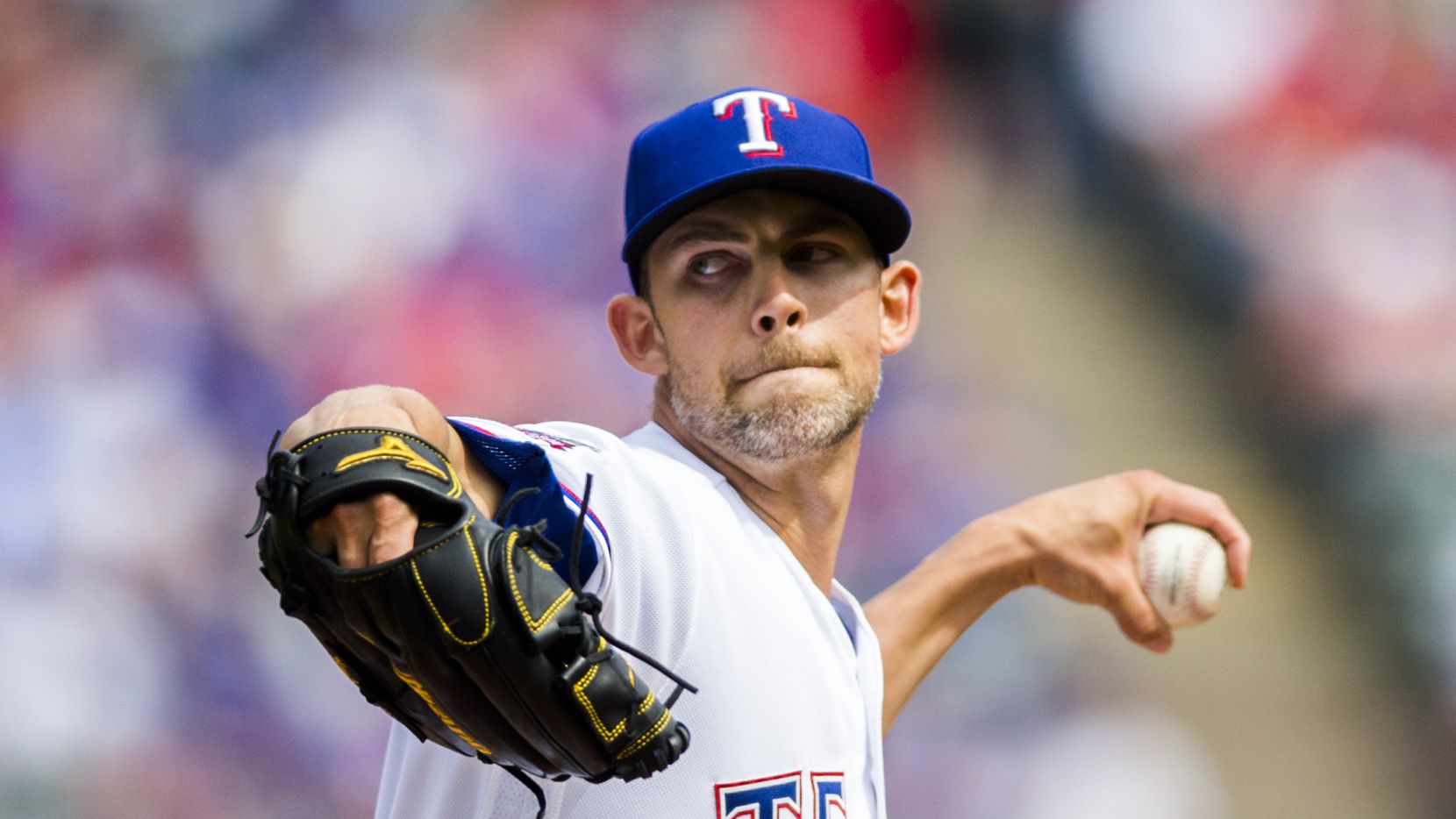 Texas Rangers starting pitcher Mike Minor (23) pitches during the first inning of an opening...