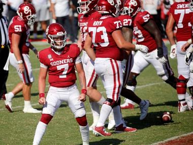 Oklahoma Sooners quarterback Spencer Rattler (7) gives a look to the student sedition after scoring a touchdown in the second overtime against the Texas Longhorns in the Red River Rivalry at the Cotton Bowl in Dallas, Saturday, October 10, 2020. Oklahoma won in quadruple overtime, 53-45.