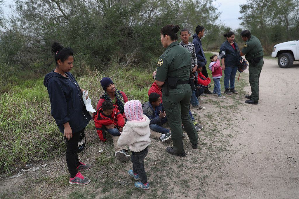 U.S. Border Patrol agents take Central American immigrants into custody near McAllen, Texas. 