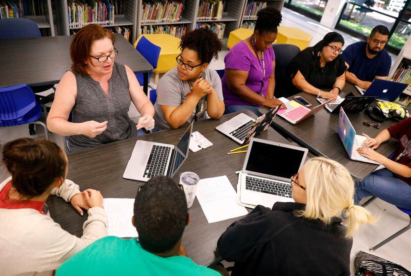 Tamara Coalson (top left) leads a discussion among teachers participating in a Professional...