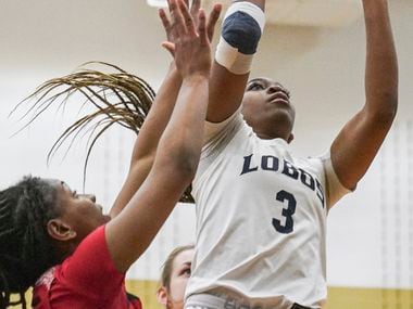 Little Elm High School’s Amarachi Kimpson (3) shoots while defended by Denton Braswell High...