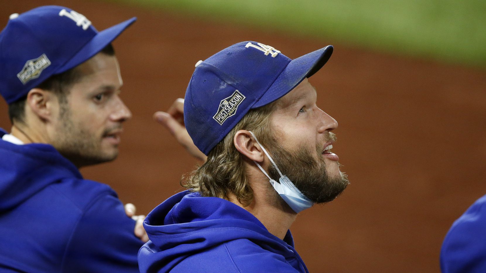 Los Angeles Dodgers starting pitcher Clayton Kershaw looks at a video replay during the...