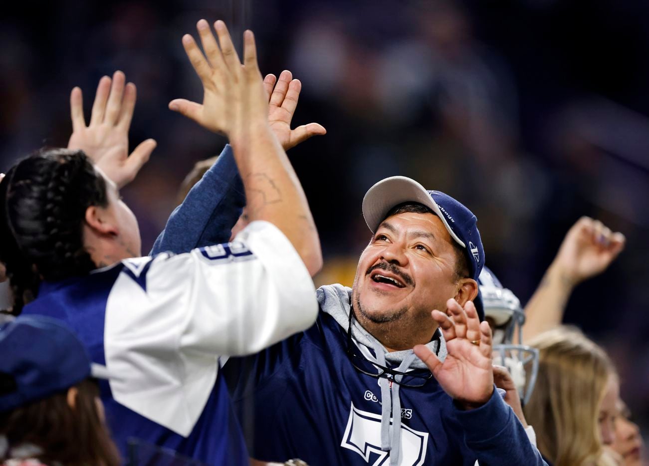 Dallas Cowboys fans celebrate their big win over the Minnesota Vikings at U.S. Bank Stadium...