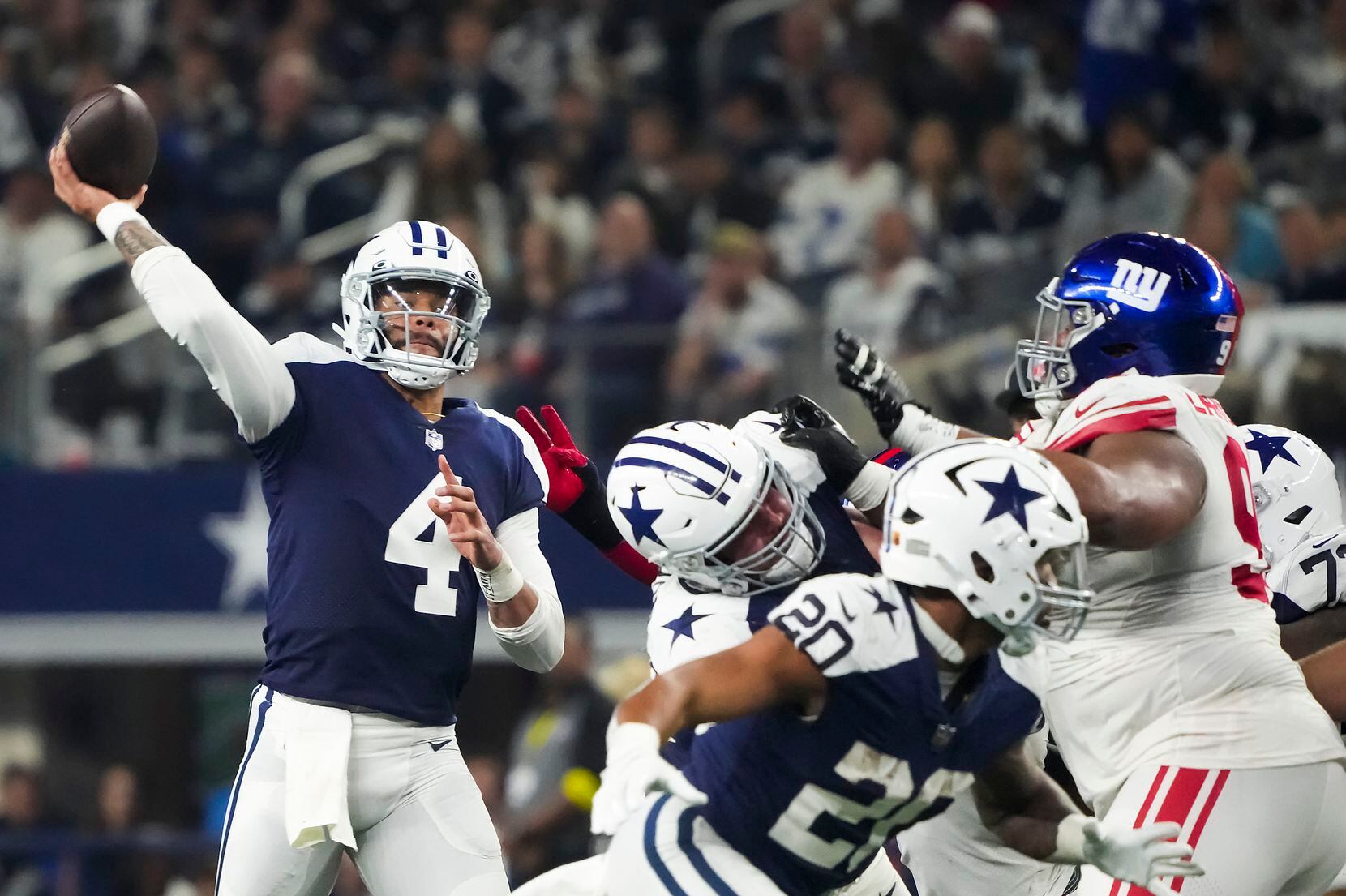 Dallas Cowboys quarterback Dak Prescott (4) throws a pass during the second half of an NFL...