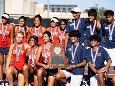 Members of the Frisco Centennial tennis team pose for a group photo at the conclusion of the...