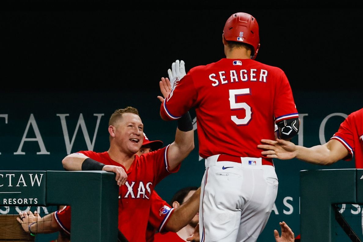 Texas Rangers shortstop Corey Seager (5) celebrates his homer against the Minnesota Twins...