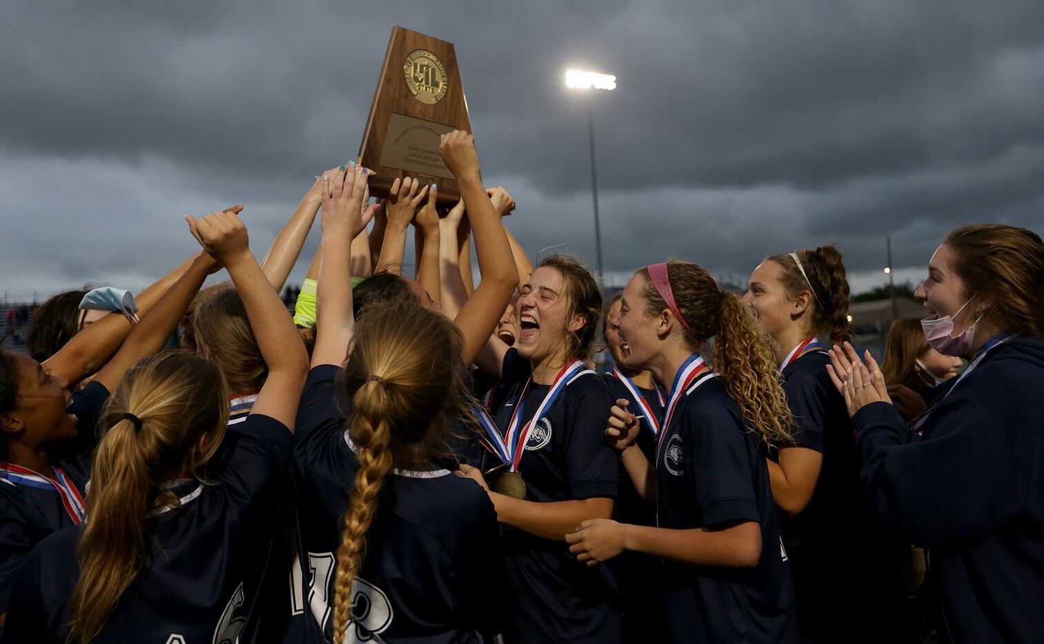 Lewisville Flower Mound players celebrate with the trophy after their UIL 6A girls State championship soccer game against Austin Vandegrift at Birkelbach Field on April 16, 2021 in Georgetown, Texas. Lewisville Flower Mound won 2-1. (Thao Nguyen/Special Contributor)