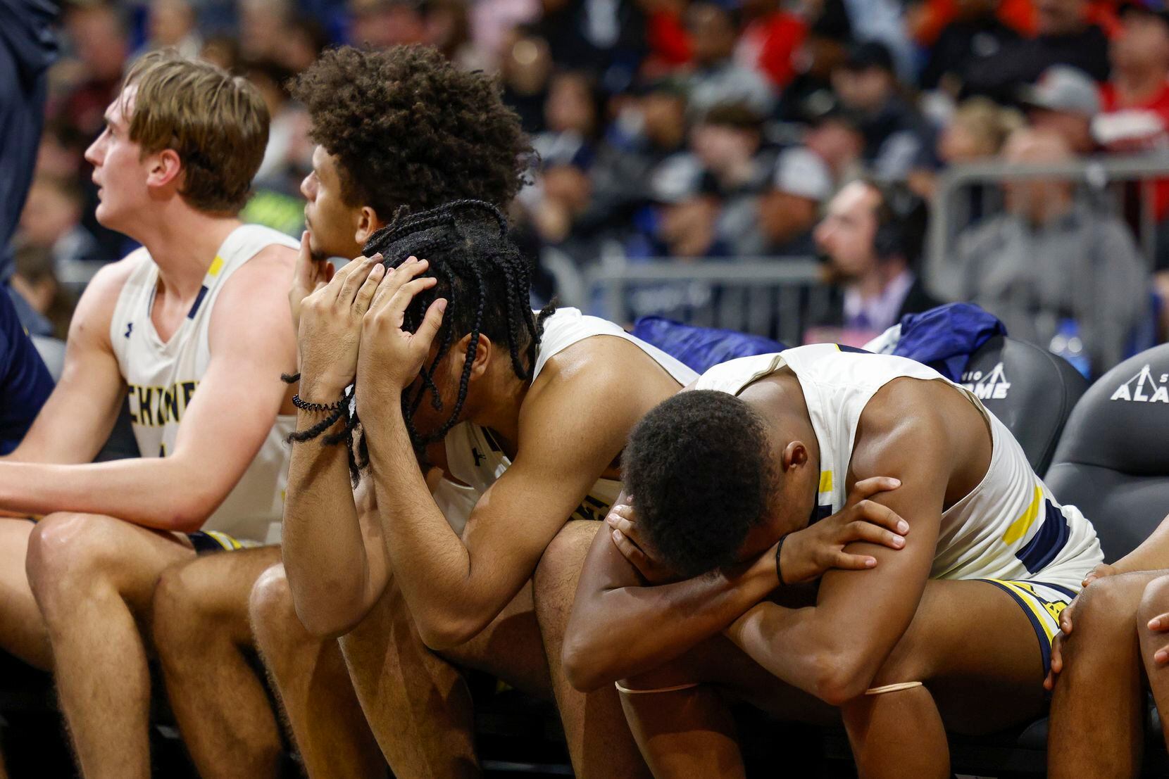 McKinney players react after a turnover during the third quarter of the Class 6A state...