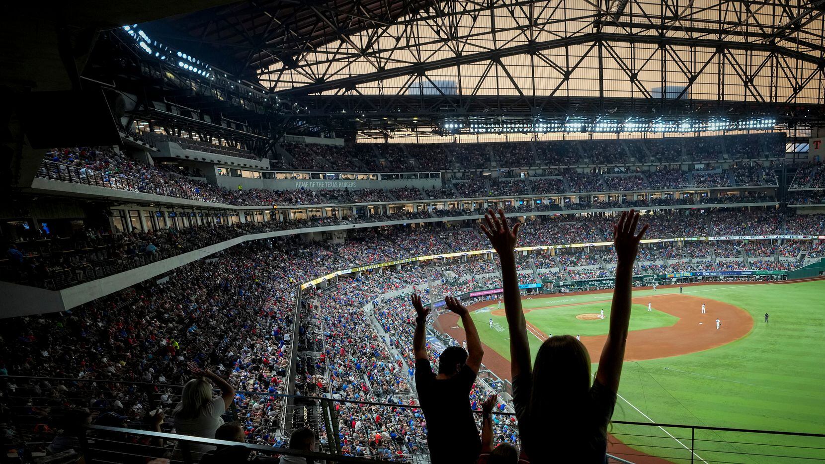 Fans cheer during a Texas Rangers game against the Chicago White Sox at Globe Life Field on...