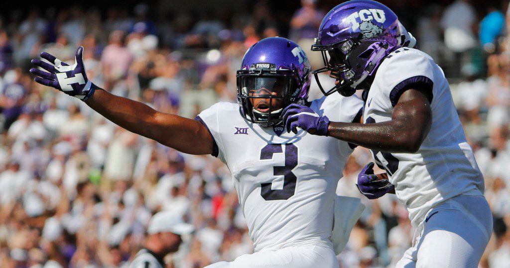TCU Horned Frogs wide receiver Shaun Nixon (3) leaps in the air with wide receiver Jalen...