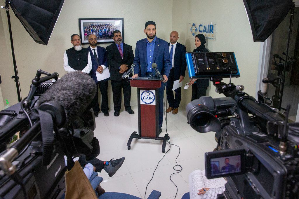 Imam Omar Suleiman (center) said airports are "a scary place for Muslims," as racial...