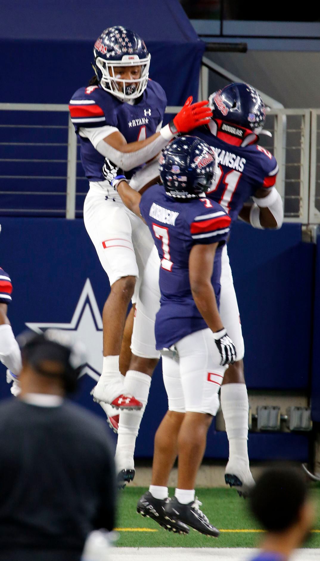 Denton Ryan’s Ty Marsh (4) celebrates his touchdown with teammates in the end zone during...