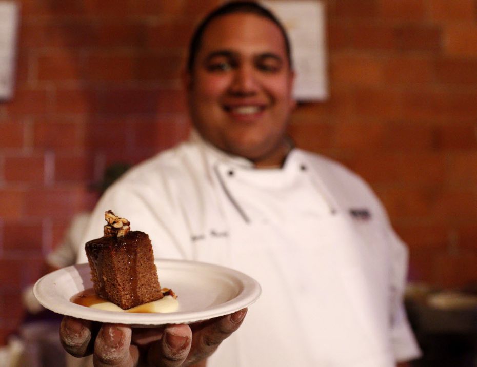 Chef Stan Rodrigues, of Whiskey Cake Kitchen & Bar, holds up a plate of whiskey cake. You've...