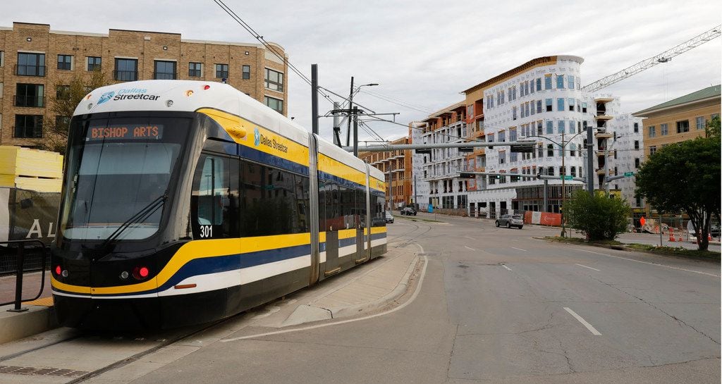 A DART streetcar passes by the corner of Zang Boulevard and Davis Street in Oak Cliff.