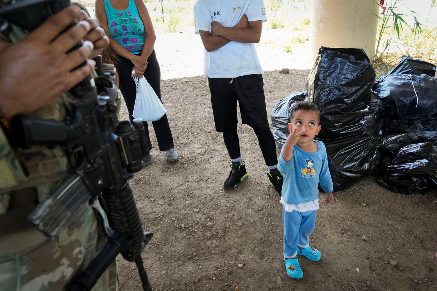 Enrique, 3, a migrant from Colombia, who arrived with a group of migrants who turned...