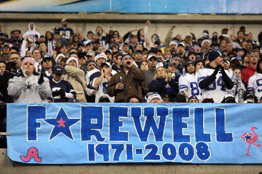 Dallas Cowboys fans cheer for the team while bidding farewell to Texas Stadium on Dec. 20,...