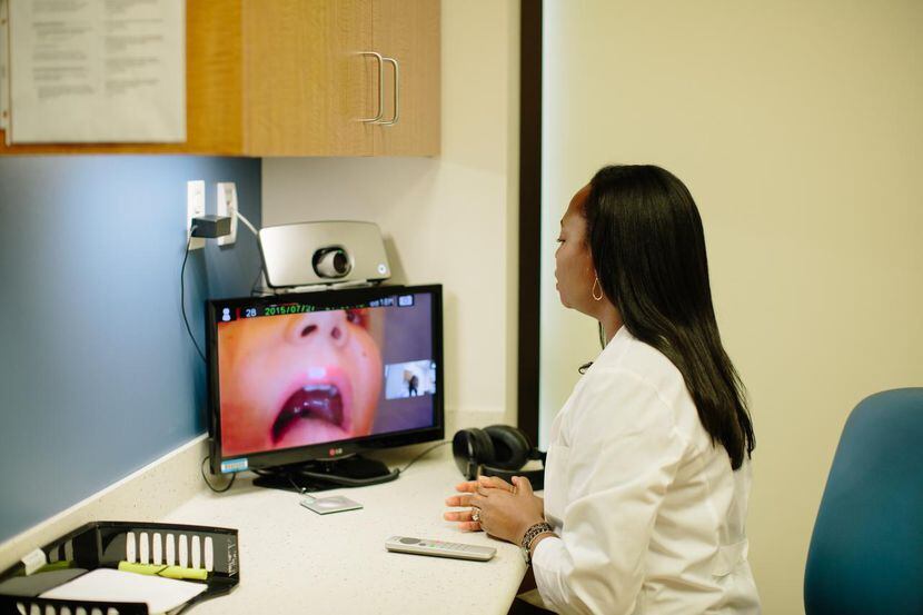 
A physician sees a young patient via video conference. Telemedicine is slowly making...