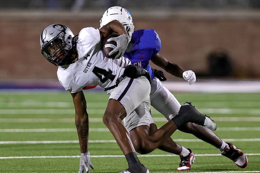 Denton Guyer wide receiver Josiah Martin (4) comes up with reception in front of Allen...