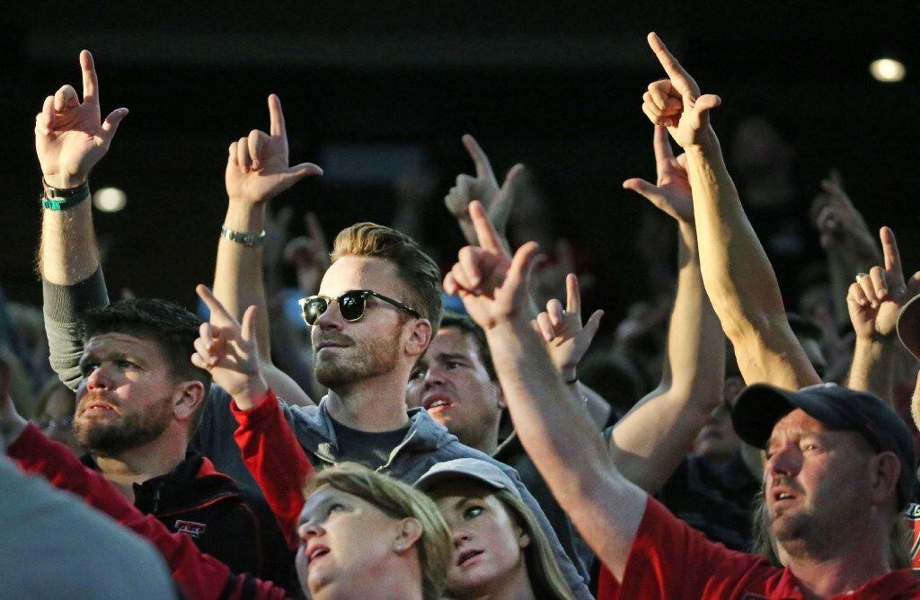 Texas Tech fans go "guns up" before kickoff during the Baylor University Bears vs. the Texas...