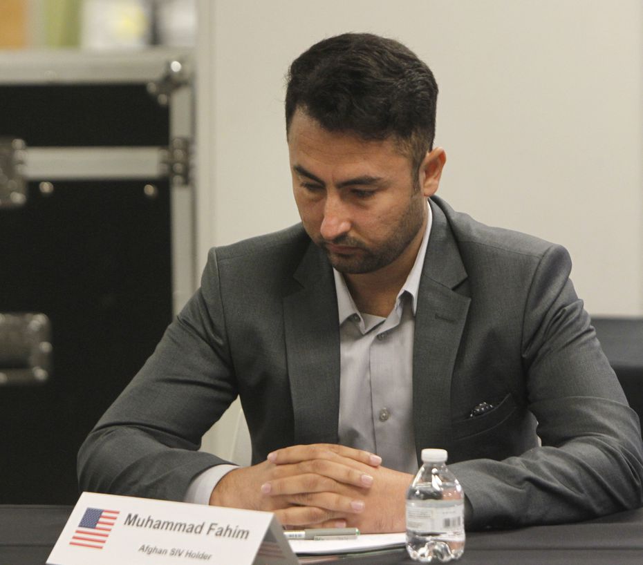 Muhammad Fahim pauses to collect his thoughts before speaking to U.S. Senator John Cornyn...