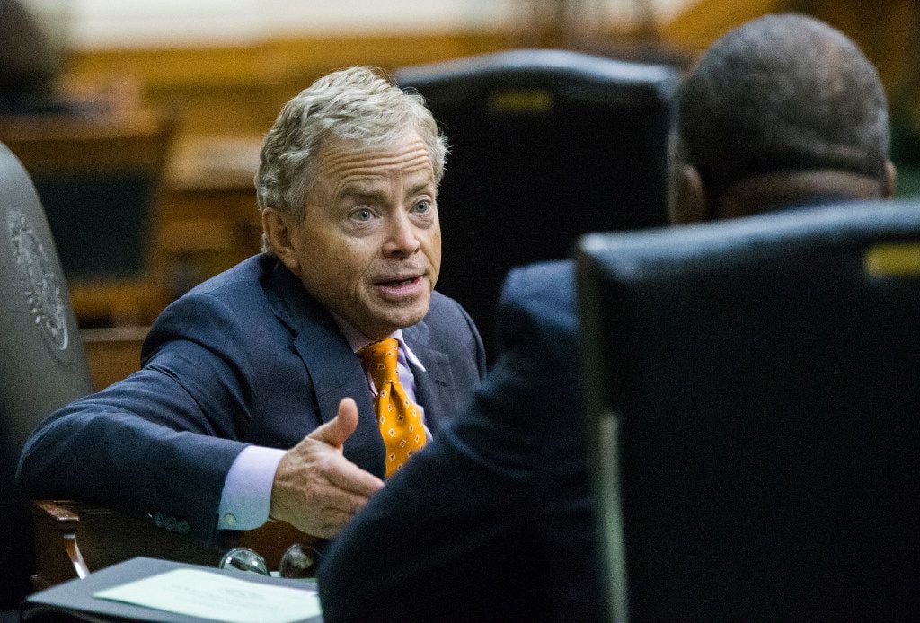 Senator Don Huffines talks to Senator Royce West during a midnight session during the third day of a special legislative session on Thursday, July 20, 2017 at the Texas state capitol in Austin, Texas. The midnight session was called to read and pass the Sunset Bill. 
