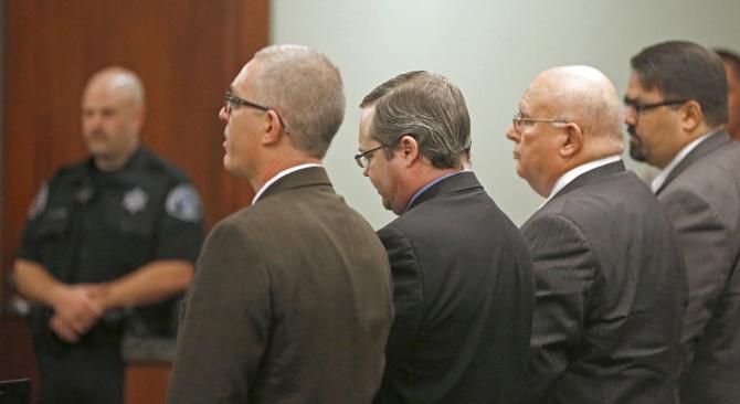 
Eric Williams, with attorneys Matthew Seymour (left), John Wright (second from right) and...