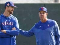 Texas Rangers pitcher Jacob deGrom, left, talks to special assistant Greg Maddux during a...