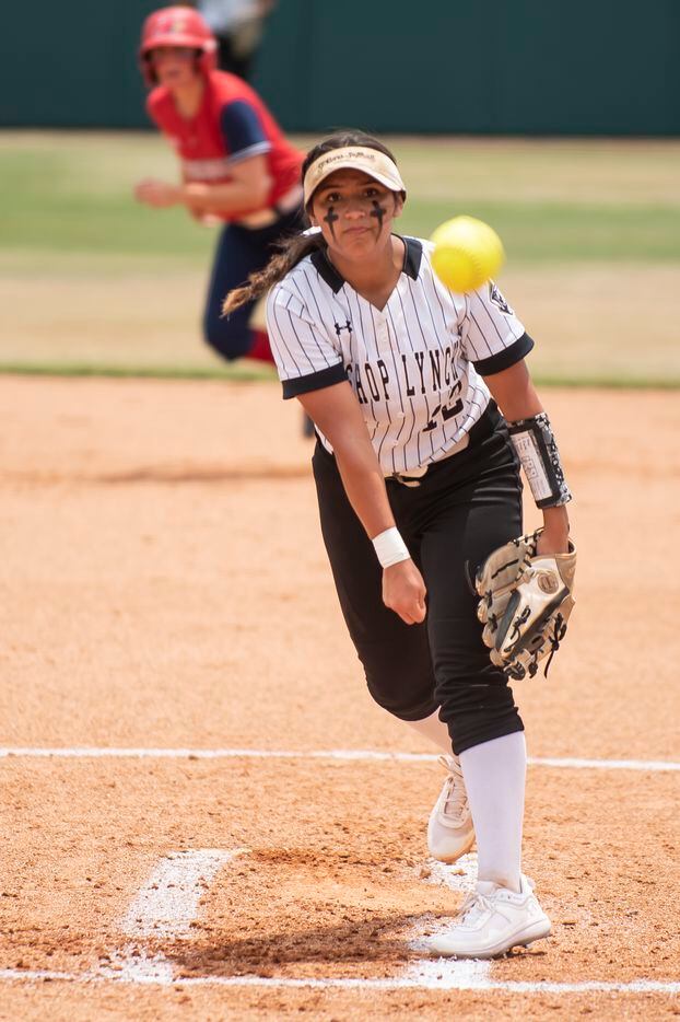 Bishop Lynch senior Evelyn Santos (12) delivers a pitch during the TAPPS Softball Division...