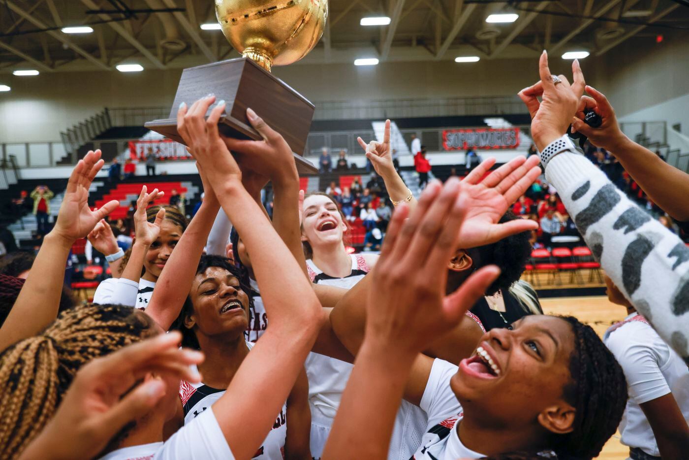 Braswell high school players cheers after winning the district 5-6A basketball game against...