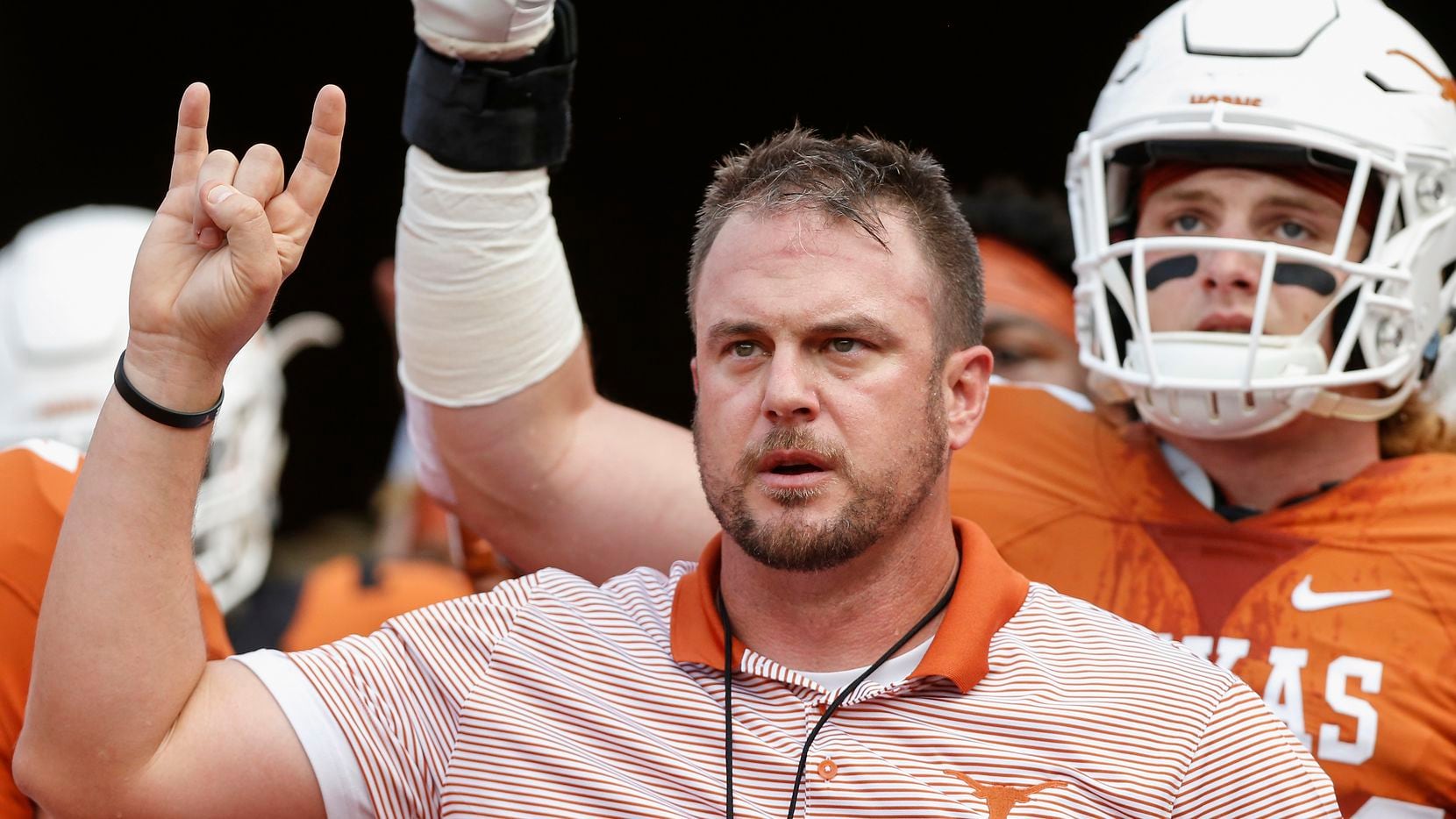 Head coach Tom Herman of the Texas Longhorns leads the team on to the field before the Orange-White Spring Game at Darrell K Royal-Texas Memorial Stadium on April 21, 2018 in Austin, Texas.
