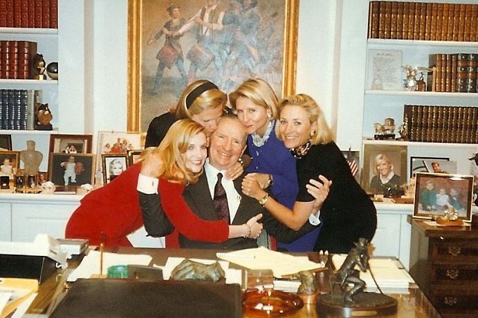 Daughters Katherine Reeves, Suzanne McGee, Nancy Perot and Carolyn Rathjen hug Ross Perot in...